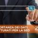 Uomo d'affari che indica un pulsante di ricerca su uno schermo