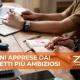 Due persone al tavolo con un laptop e un quaderno