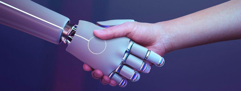 intelligenza-artificiale-nel-marketing-digitale-perche-e-utile-alle-pmi Mano robotica e mano umana si incontrano in una stretta di mano